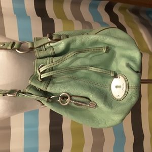 Green fossil purse new with out tags attached.